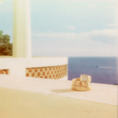 jewels put on a wall with the sea in background